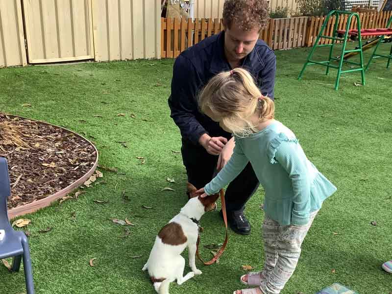 Community visits with a child and Lions Assistance Dog, Sherbet