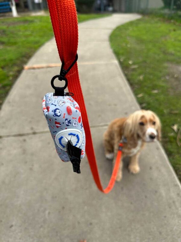 Lions Assistance Dog - pet bag dispenser with Betty on a lead